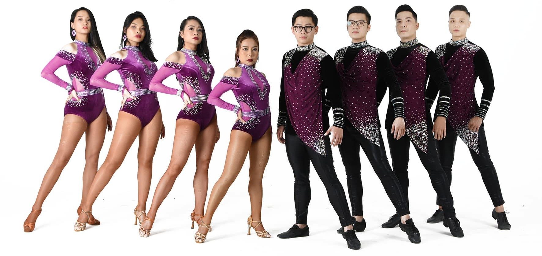 Dance team in coordinated purple costumes